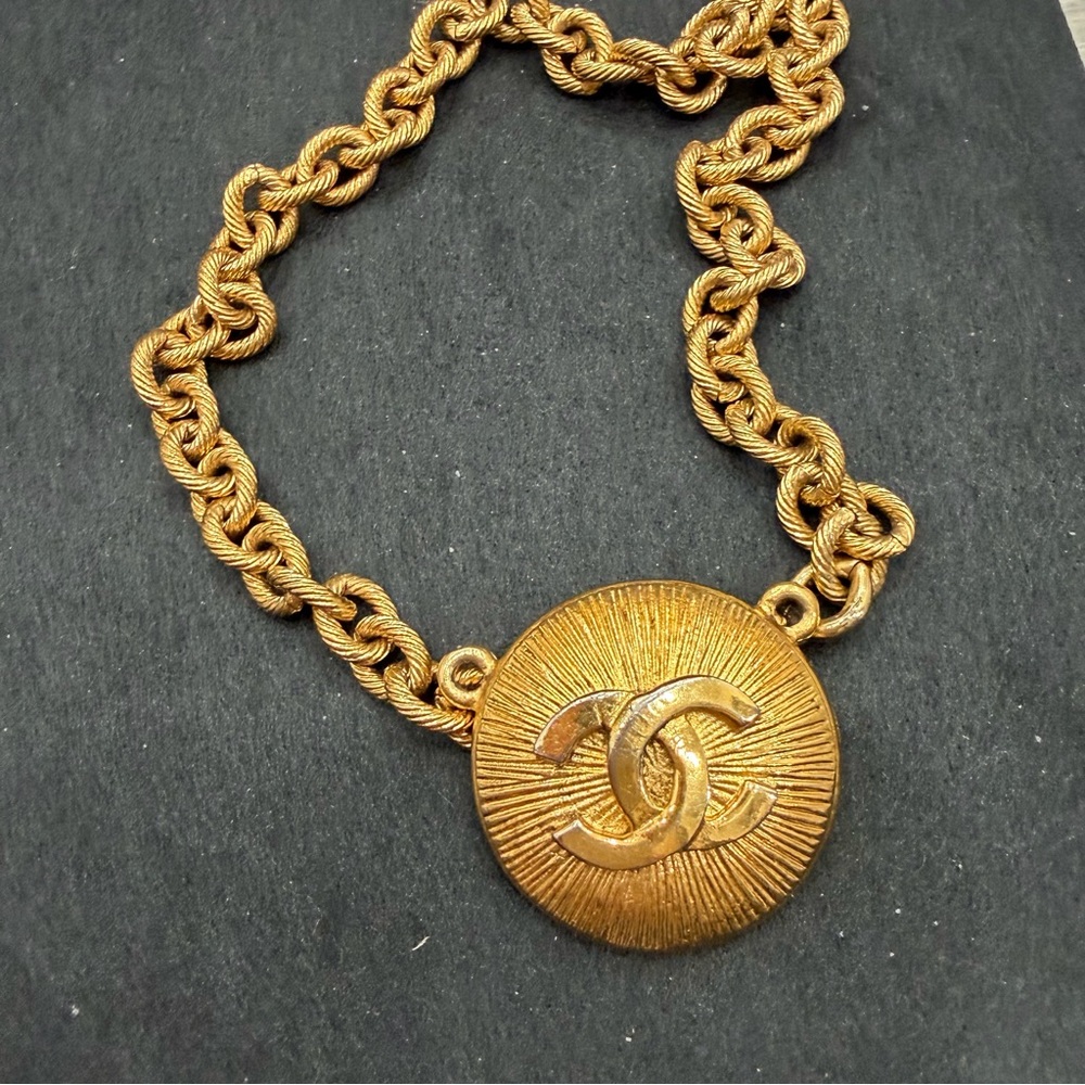 Radiant Gold Toned Chanel Pendant with a Chain bracelet - Picture 1 of 3